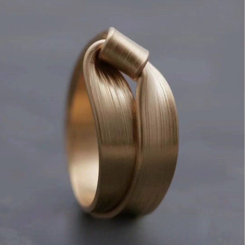 Geometric Twisted Band Ring Modern Polished Golden Finish